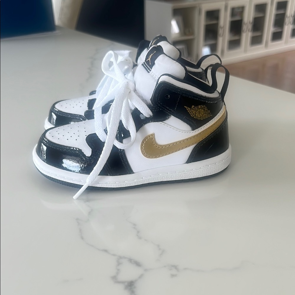 Kids Nike Black and Gold Jordans